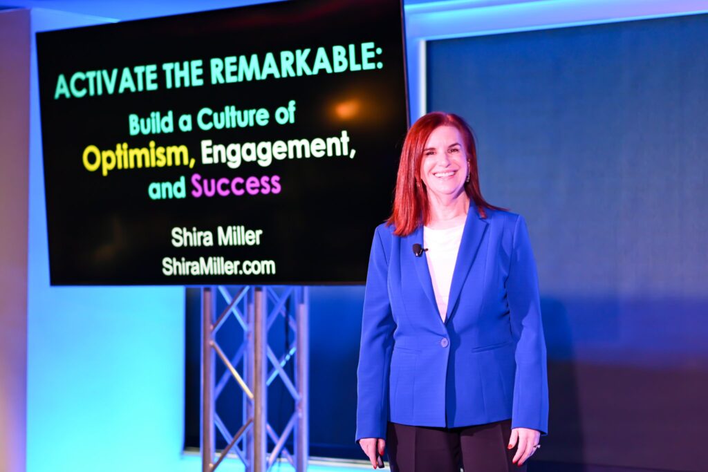 Keynote speaker presenting in the Dallas event space