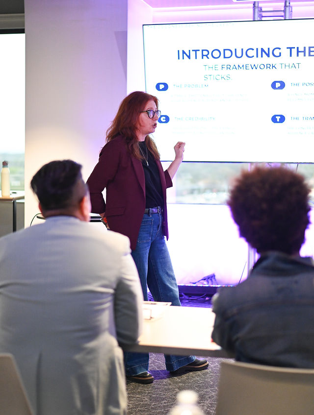 Presenter leading a workshop in the Dallas event space